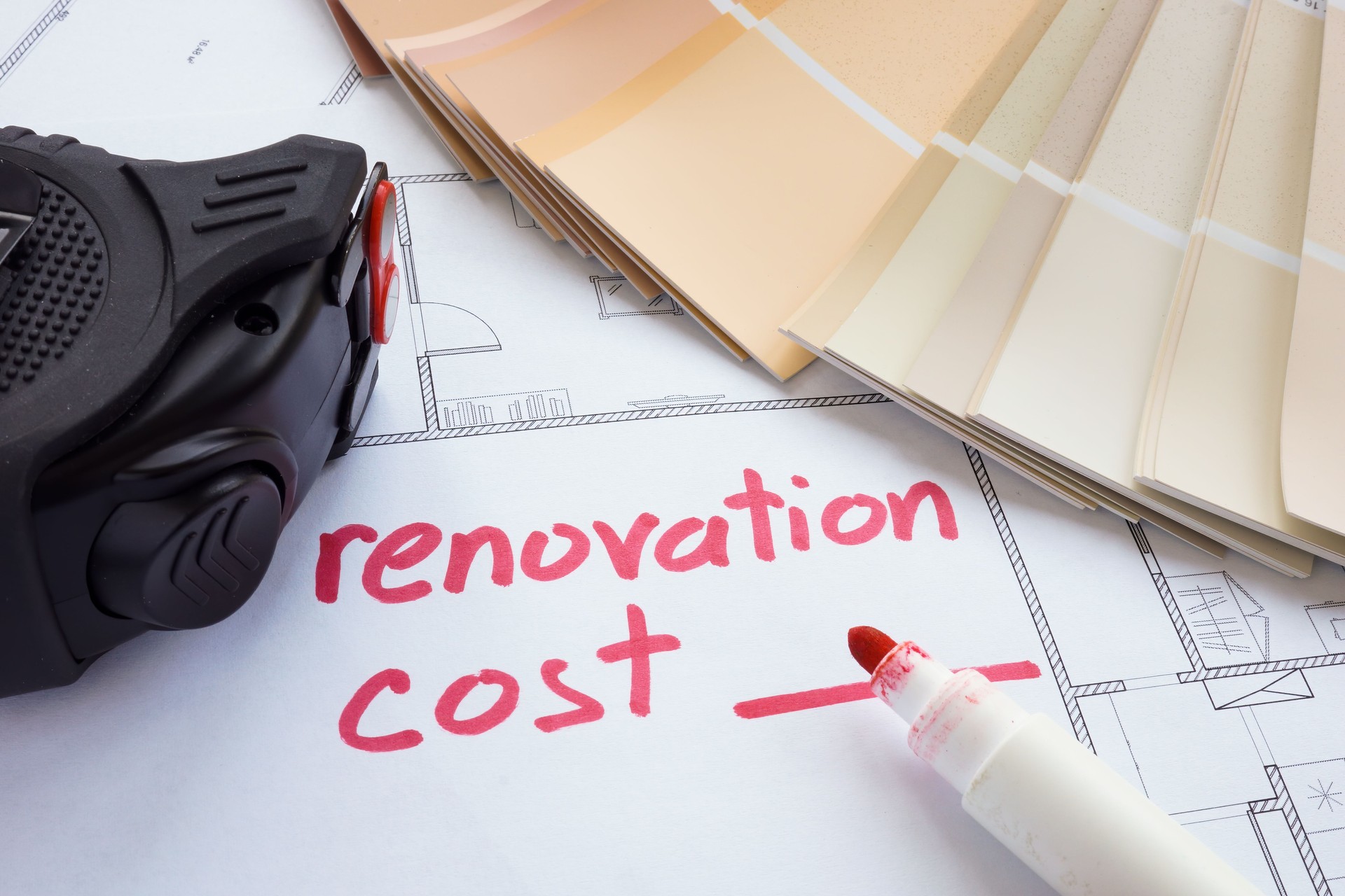Renovation cost estimate with tape measure and color palette.